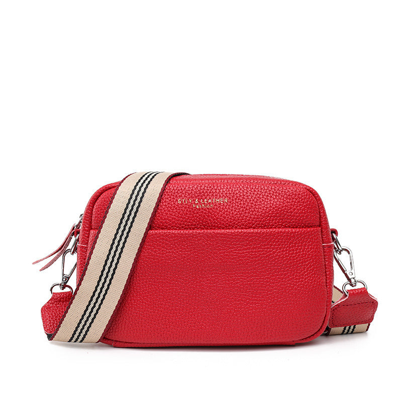 Sac bandoulière asymétrique net noir‑rouge