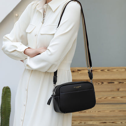 Sac bandoulière asymétrique net noir‑rouge